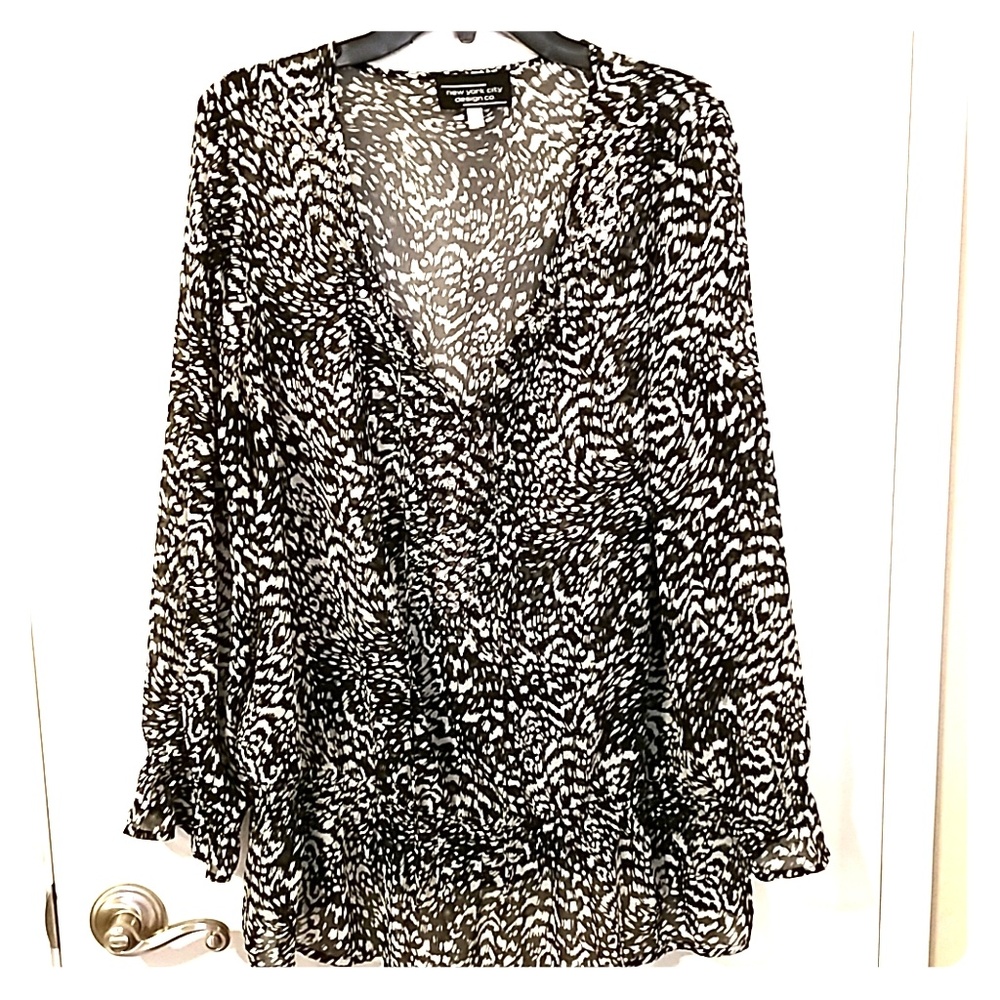 Sheer blouse with silver sequins along neckline
